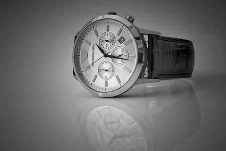 round silver-colored chronograph watch with black leather strap displaying 1:30 time thumbnail