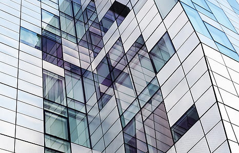 low angle photography of white and blue curtain wall high-rise building thumbnail