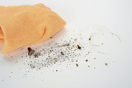 person about to clean dusts with orange towel thumbnail