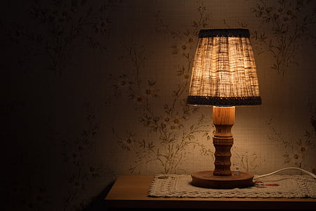 brown table lamp turned on on table thumbnail