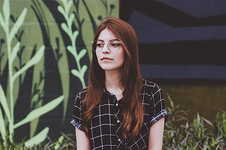 woman in black and white button-up top wearing eyeglasses photography thumbnail