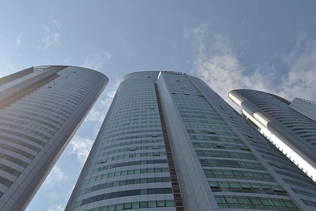 low angle curtain wall buildings under clear sky thumbnail