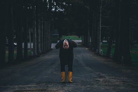 Woman Bending in Middle of Road thumbnail