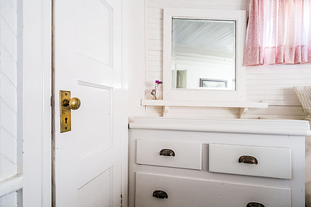 brown wooden dresser with mirror near the door thumbnail