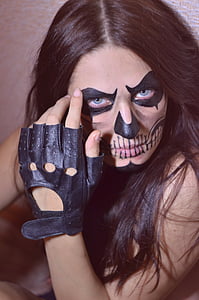 woman with skeleton makeup and black glove thumbnail