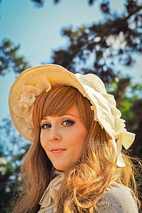 smiling woman taking photo during daytime thumbnail