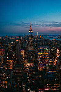 buildings with lights during dawn thumbnail