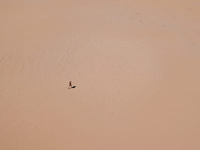 aerial view photography of person in the middle desert thumbnail