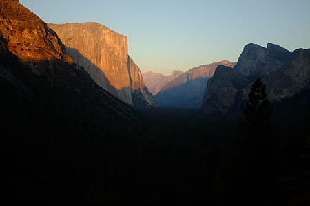 rocky side mountain under blue sky thumbnail