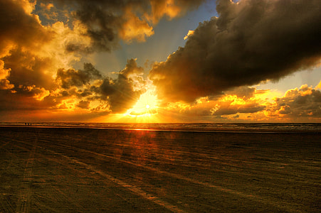 silhouette of seashore at sunset thumbnail