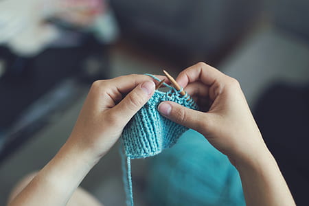 person holding knit textile thumbnail