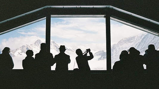 silhouette of people in crowded room during daytime thumbnail