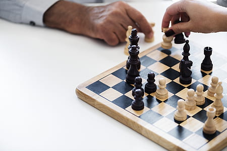 chess-hands-chess-piece-chess-board-thumb.jpg