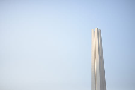 white concrete tower under blue sky at daytime thumbnail