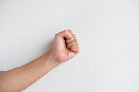 person showing human fist thumbnail