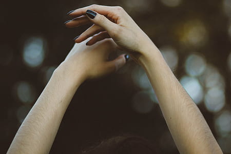 depth of field photography of human hands thumbnail