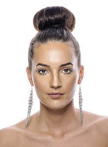 woman with silver charm earrings thumbnail