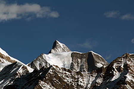 mountains with snow during daytime thumbnail
