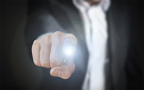 shallow focus photography of person finger thumbnail
