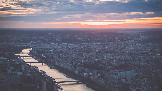 bird's eye view of city near river thumbnail