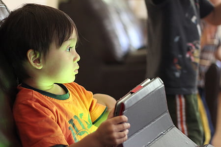 boy holding tablet computer thumbnail