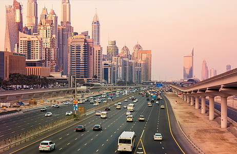 cars and buses travels on expressway during daytime thumbnail