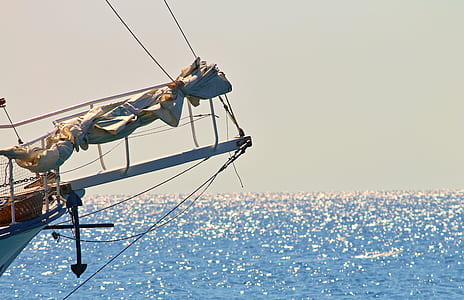 white sailing ship on ocean during daytime thumbnail