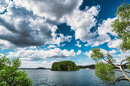 low-angle photography of island beside body of water thumbnail