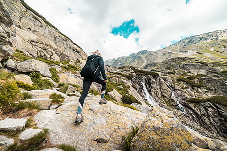 Young Fit Woman Hiking to the Waterfall Mountain thumbnail