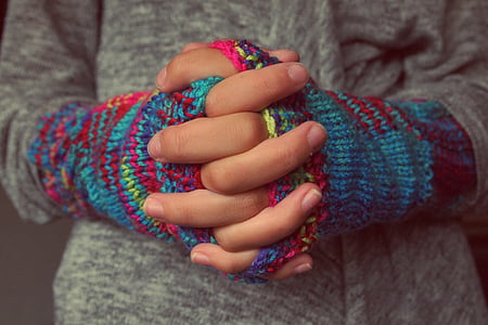 person wearing multicolored gloves thumbnail
