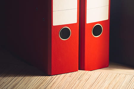 two red book binders thumbnail