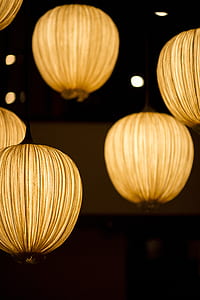 lighted round yellow lanterns in selective focus photography thumbnail