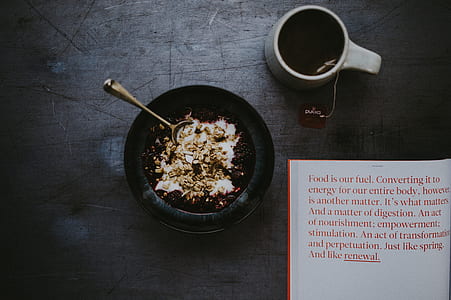 food on bowl near white mug thumbnail