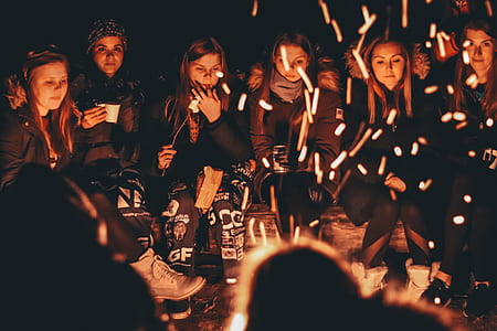 group of girl standing in front of bonfire thumbnail