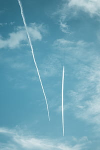 aircraft in flight creating contrails thumbnail