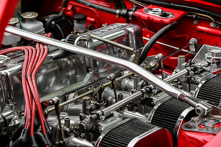 gray and red vehicle engine bay close-up photo thumbnail