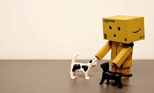 brown box robot playing with cats toys thumbnail