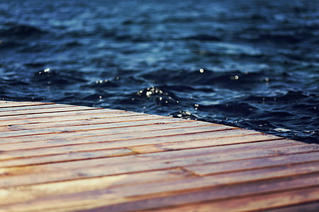 brown wooden dock on water thumbnail