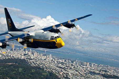 blue and white plane in flight thumbnail