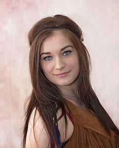 brown haired girl in brown sleeveless top thumbnail