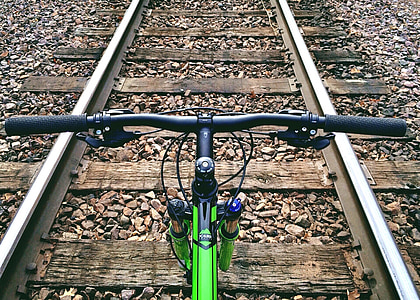 green bike in railway photo thumbnail
