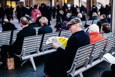 people sitting on bench outside thumbnail