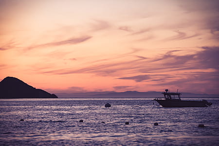 Boat on Sea during Golden Hour thumbnail