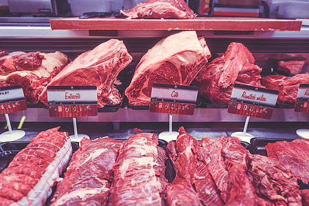 bunch of raw meats on display counter thumbnail