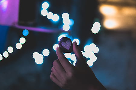 person holding heart cookie thumbnail