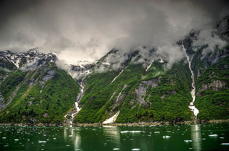 green mountains near body of waster thumbnail
