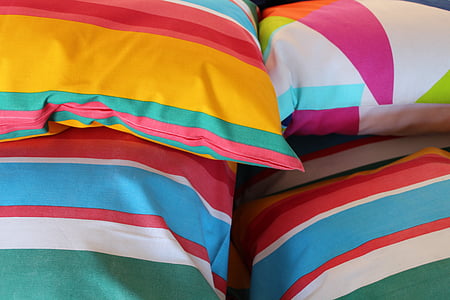 four assorted-color throw pillows thumbnail