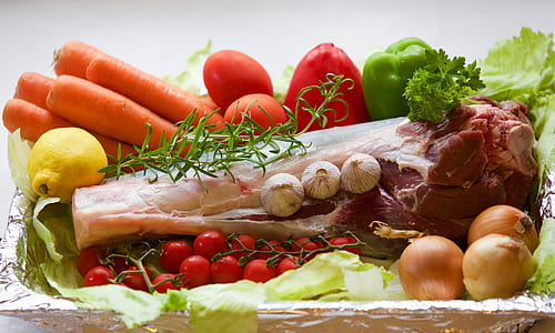 bone surrounded by vegetables and spices thumbnail