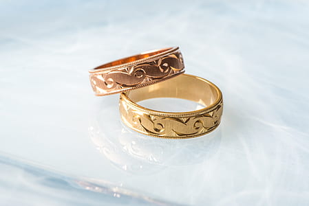 two gold-colored rings thumbnail