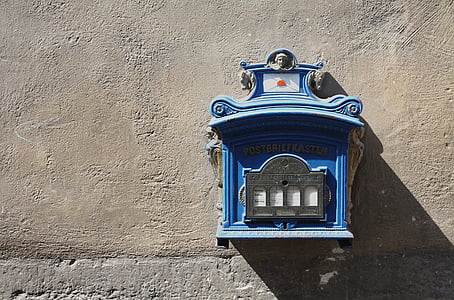 blue mailbox hanged on wall thumbnail